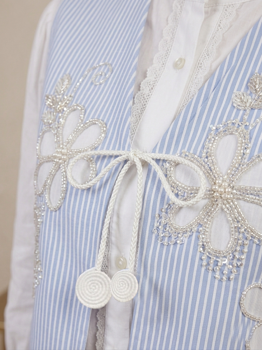Stripped vest with white shirt